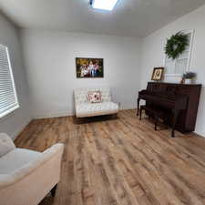 Sitting room featuring wood finished floors and baseboards