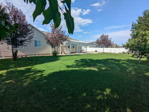 View of yard with a pergola and a patio area