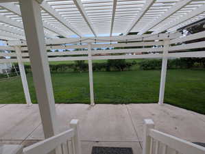 Fenced backyard featuring a patio area and a pergola