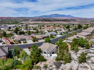 Aerial perspective of suburban area featuring a mountainous background