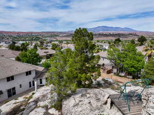 Aerial perspective of suburban area featuring a mountainous background