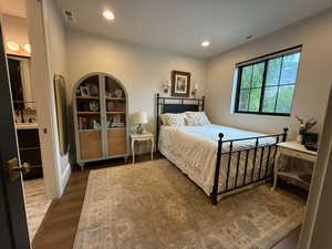 Bedroom featuring wood finished floors and recessed lighting