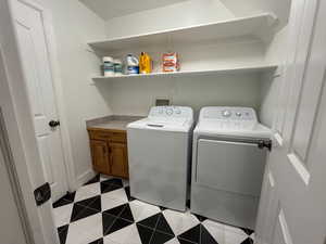 Laundry area featuring independent washer and dryer