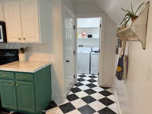Laundry area with independent washer and dryer.