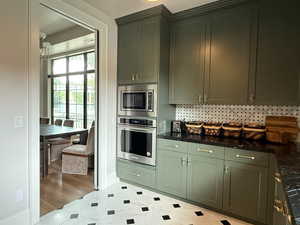 Includes oversized fridge and freezer, dishwasher, ice-maker, filtered water, instant hot water tap, and a built-in oven and microwave.