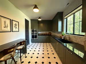 Includes oversized fridge and freezer, dishwasher, ice-maker, filtered water, instant hot water tap, and a built-in oven and microwave.