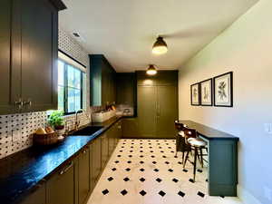 Includes oversized fridge and freezer, dishwasher, ice-maker, filtered water, instant hot water tap, and a built-in oven and microwave.