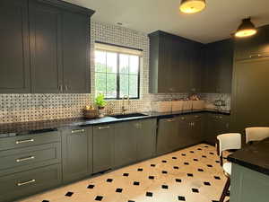 Includes oversized fridge and freezer, dishwasher, ice-maker, filtered water, instant hot water tap, and a built-in oven and microwave.