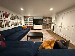 Living room featuring wood finished floors and recessed lighting