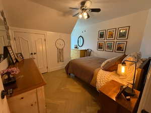 Bedroom with vaulted ceiling and ceiling fan