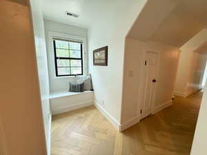 Corridor featuring baseboards