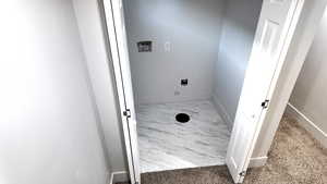 Laundry room featuring electric dryer hookup and washer hookup