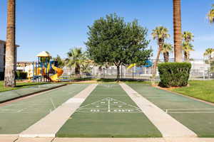 View of property's community with shuffleboard