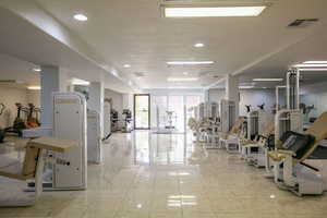Exercise room featuring recessed lighting