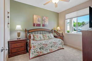 Bedroom featuring carpet floors and ceiling fan