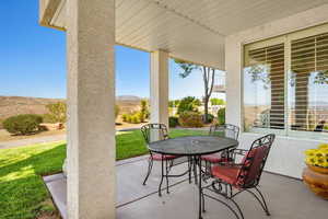 View of patio / terrace with outdoor dining area and a mountain view
