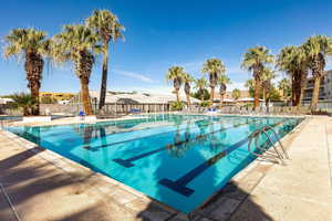 Community pool with a patio area