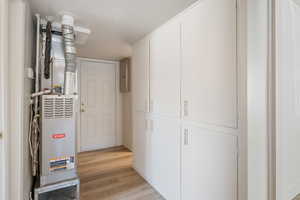 Utility room featuring heating unit