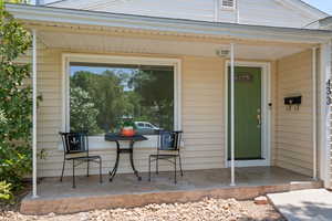 Entrance to property featuring a porch
