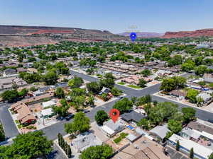 Aerial view of residential area featuring a mountain backdrop