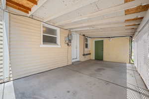 View of patio featuring a carport