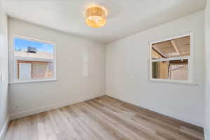 Spare room with light wood finished floors and baseboards