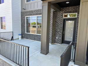Property entrance with brick siding