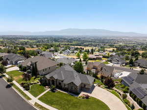Aerial perspective of suburban area featuring a mountain backdrop