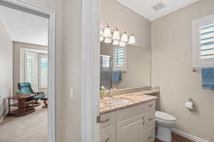 Bathroom with vanity and toilet