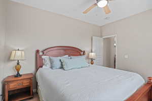 Bedroom featuring a ceiling fan and carpet flooring
