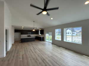 Unfurnished living room featuring recessed lighting, ceiling fan, light wood finished floors, and high vaulted ceiling