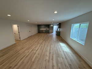 Unfurnished living room with recessed lighting and light wood-style flooring