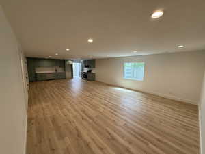 Unfurnished living room with recessed lighting and light wood-style flooring