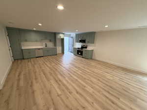 Unfurnished living room with light wood-style flooring and recessed lighting