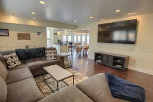 Living room featuring wood finished floors and recessed lighting