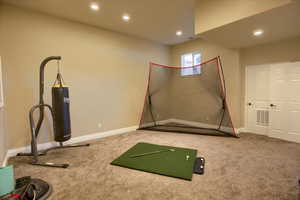 Workout room featuring carpet and recessed lighting