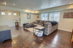 Living area featuring hardwood / wood-style floors and recessed lighting