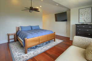 Bedroom with wood finished floors, recessed lighting, lofted ceiling, and ceiling fan
