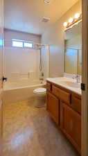 Full bathroom with shower / bath combination, vanity, and tile patterned floors