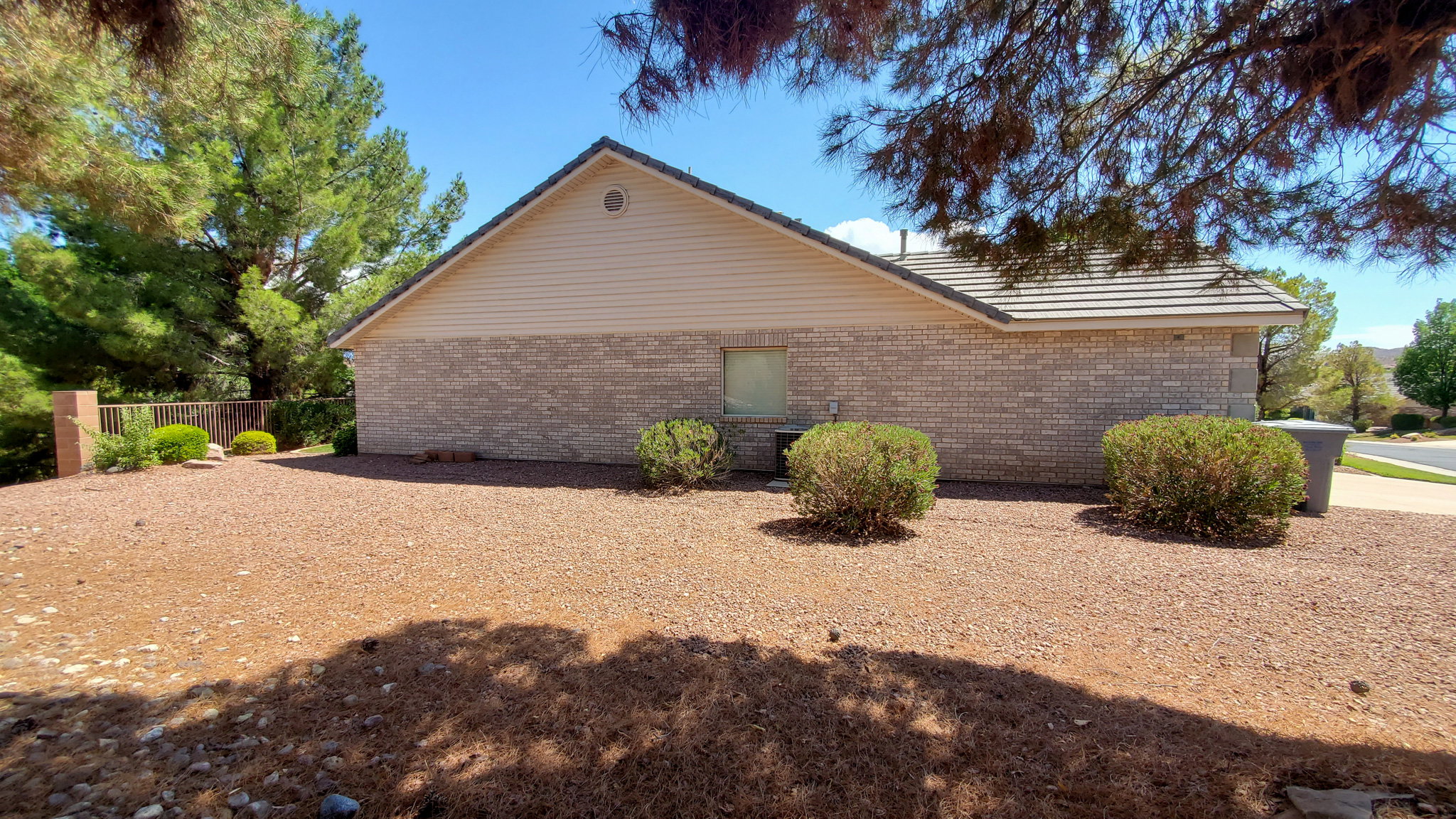 View of side of property featuring brick siding