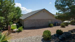 View of home's exterior featuring brick siding