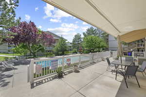 View of patio featuring a community pool