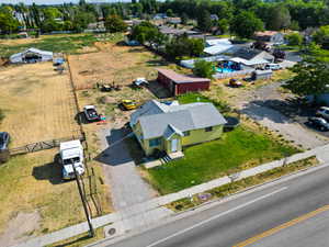 Aerial view of property and surrounding area featuring a pool