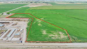 Aerial view of sparsely populated area with property parcel outlined
