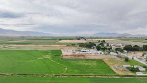 View of mountain backdrop with rural landscape