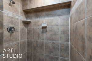 Bathroom with tiled shower
