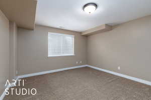 Empty room with carpet flooring