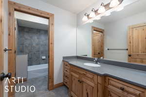 Full bath with tile patterned flooring and vanity