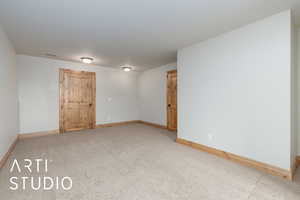 Unfurnished room with baseboards and carpet floors