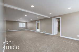 Carpeted empty room featuring recessed lighting